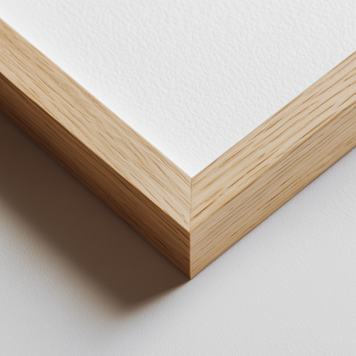 Close-up of a wooden picture frame corner on a white background