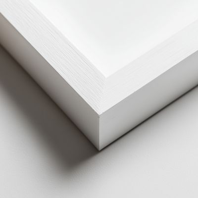 Close-up of a white wood frame corner on a light gray background